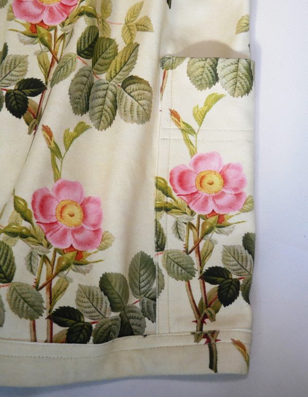 close up of girls jersey pinafore dress pocket