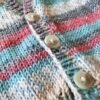 close up of baby cardigan knit