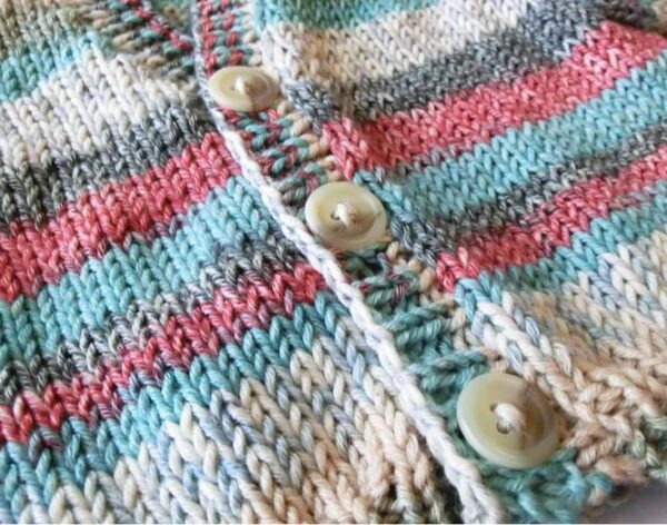 close up of baby cardigan knit